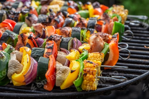 Preview: Hot skewers on grill with meat and vegetables in summer