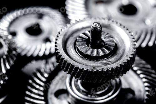 Preview: Close up view of metal gears on a black background showing mechanical parts in focus