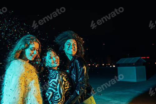 Preview: Smiling girls enjoying party at night on the roof