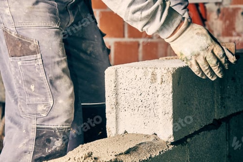 Preview: Real Construction Worker Bricklaying The Wall Indoors.
