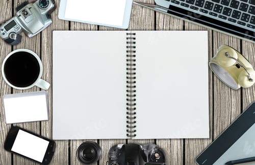 Preview: Top view of open leather book and office accessory on wooden background