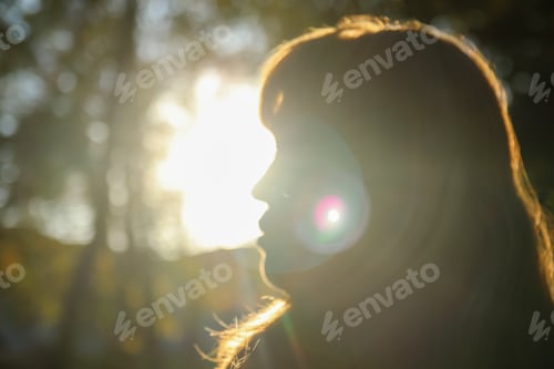 Preview: Close-up silhouette side view of woman looking at sunset. Mental health, hope, happiness concept. Dr