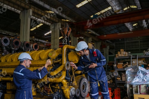 Preview: Technicians work at train engine repair shop.