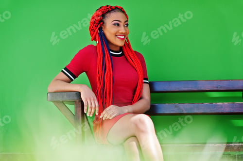 Preview: African american girl in red dress with dreadlocks