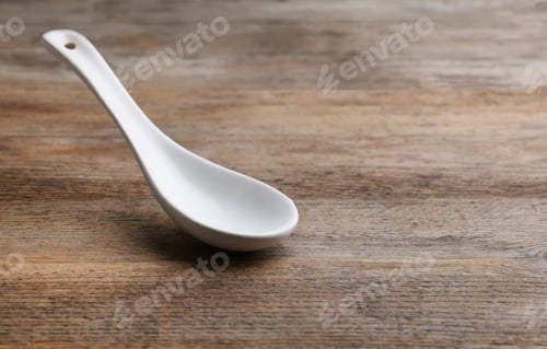 Preview: Clean empty miso spoon on wooden background, space for text