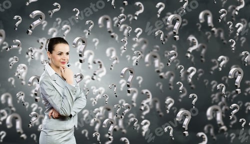 Preview: Portrait Of Pretty Young Businesswoman And Many Question Marks Around