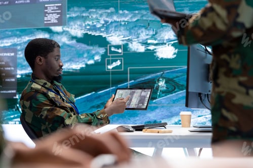 Preview: Military staff in a high tech command post work on intelligence gathering