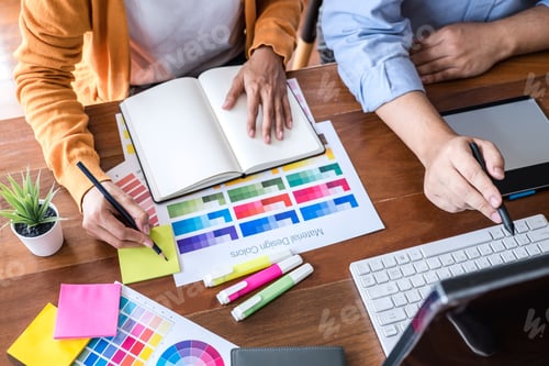 Preview: Two colleague creative graphic designer working on color selection and color swatches