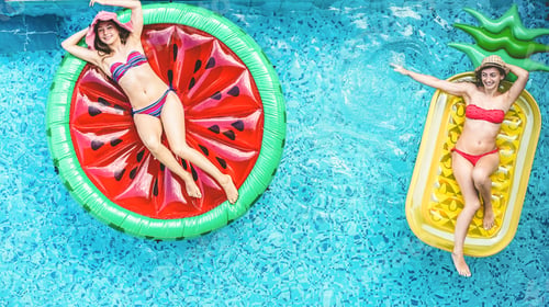 Preview: Happy friends having fun inside swimming pool during summer vacation - Focus on faces