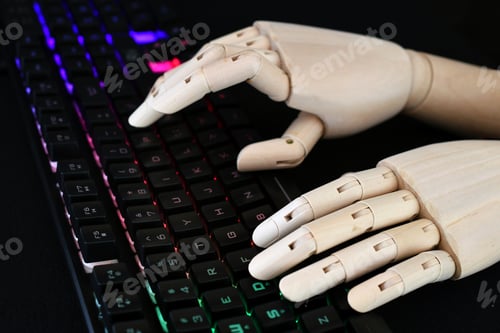Preview: AI artificial intelligence concept - robot hands typing on lit keyboard