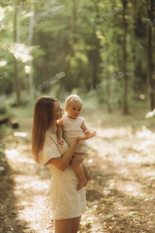 Preview: Mother and daughter exploring forest, enjoying wildlife nature looking up at the trees
