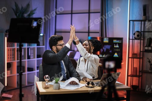 Preview: Positive multiracial partners giving high five, african american businesswoman and indian broker