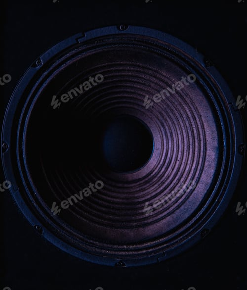 Preview: Close-up of speaker membrane on black background.