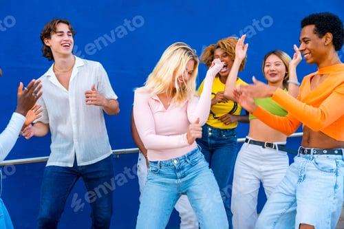 Preview: Blonde young woman dancing in a dance battle with friends