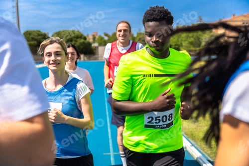 Preview: Athletes running on track during competition