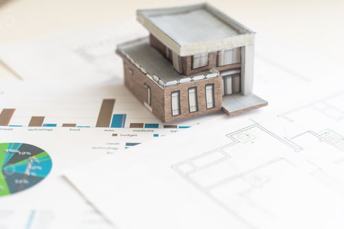 Preview: Close up of handmade small white cardboard houses. Shallow focus. Do it yourself. Architecture