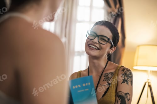 Preview: Beautiful Shirt Hair White Tattooed Woman Holding Travel Brochure Smiling