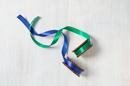 Preview: Skeins of ribbons on white wooden background