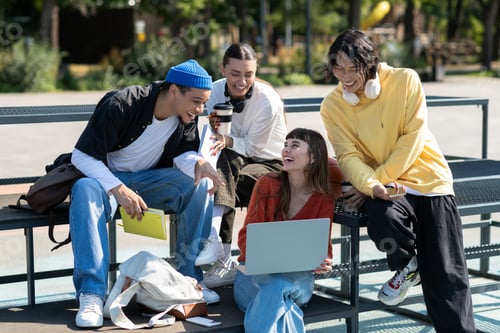 Preview: Friends enjoy a lively gathering in the park while sharing laughter and creativity together