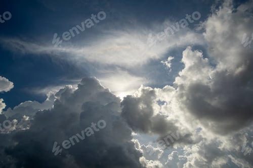 Preview: White fluffy cumulonimbus clouds forming before thunderstorm on summer blue sky