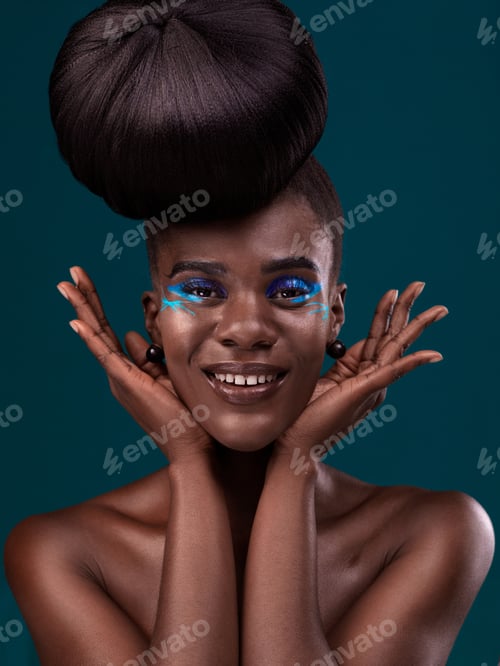 Preview: Beauty meets art. Studio portrait of a beautiful young woman posing against a dark background.