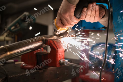 Preview: Man hands polish a motorcycle metal part. Repair work and occupation