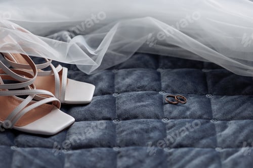 Preview: Gold Wedding Rings on Blue Quilted Fabric