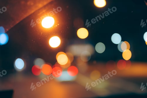 Preview: abstract blurry shiny bokeh background of street or road traffic night light in the city
