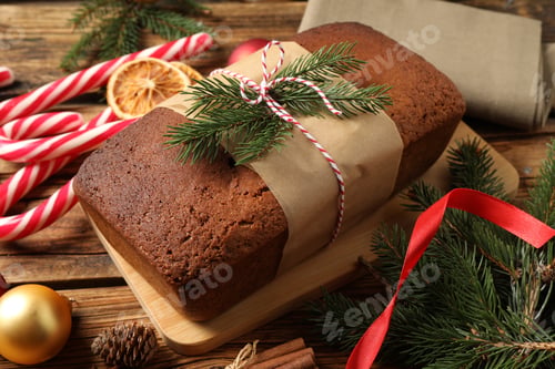 Preview: Delicious gingerbread cake, candy canes and Christmas decor on wooden table