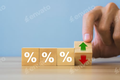 Preview: Interest rateand dividend concept.Hand holding wooden block with arrow and percentage symbol