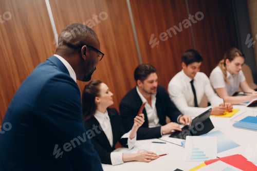 Preview: Businessman and businesswoman team at office meeting. Business people group conference discussion