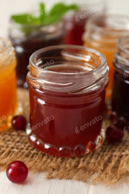 Preview: Jar of sweet jam on table, closeup