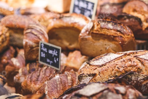 Preview: Breads on a showcase in a French bakery. Soft focus, close up view.
