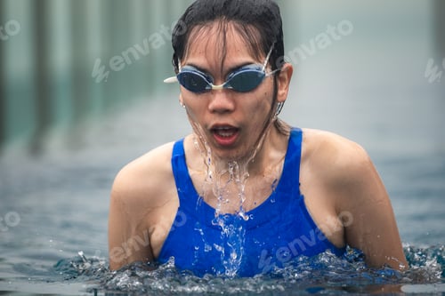 Preview: young sport woman person swimming in water pool, healthy female people in blue swimwear