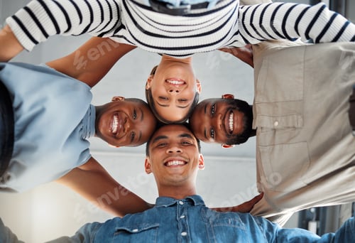 Preview: Portrait of a group of young diverse businesspeople smiling and huddling in support at work. Joyful