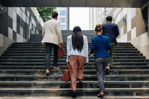 Preview: Business people walking up the stairs