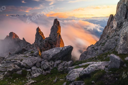Preview: Summer landscape view of a rock formation at sunset as the fog came in