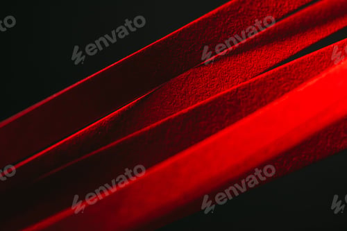 Preview: close up view of red quilling striped paper on black