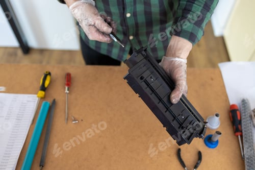 Preview: Toner replacements in printer cartridge. Printer service concept. Disassembly of the printer cartrid