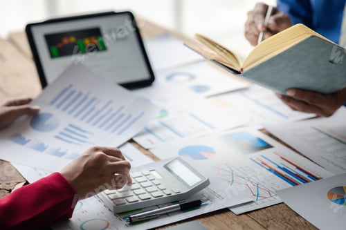 Preview: Business Professionals Analyzing Charts and Graphs at Work