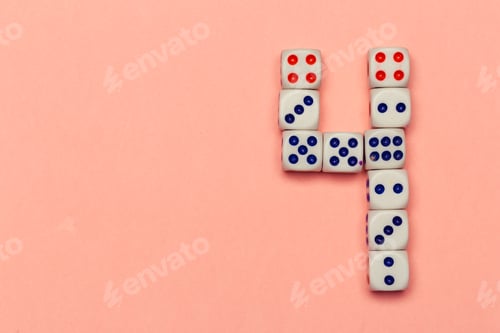 Preview: Number four lay out of dice on peachy background close up