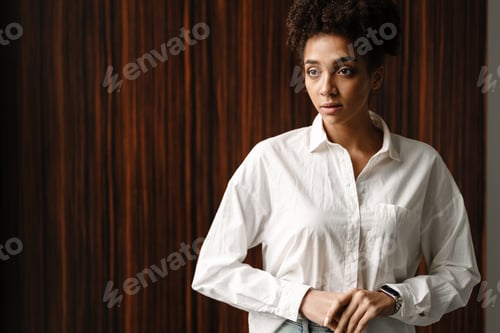 Preview: Woman in a White Shirt Poses Indoors