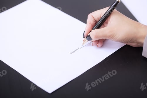 Preview: Hands of business woman signing the contract document