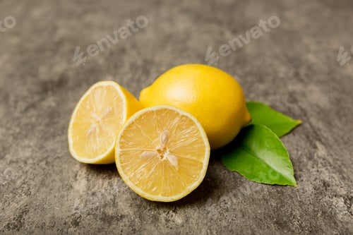Preview: Many fresh ripe lemons with green leaves on colored background, top view, space for text