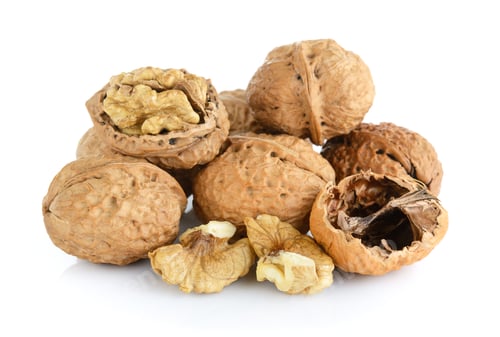 Preview: walnut and a cracked walnut isolated on the white background