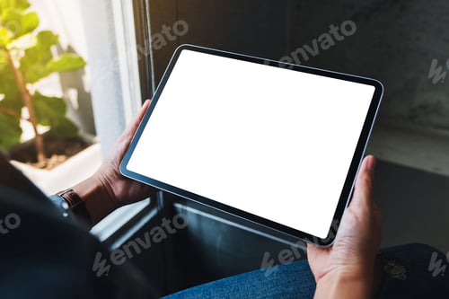 Preview: Mockup image of a woman holding black tablet pc with blank white horizontal screen in cafe