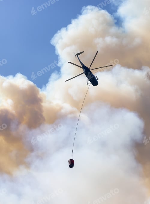 Preview: Wildfire Service Helicopter flying over BC Forest Fire and Smoke on the mountain near Hope