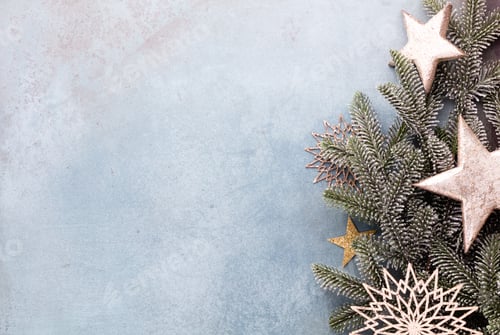 Preview: Christmas composition fir tree branches, gold sterne on blue background.
