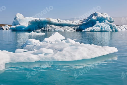Preview: Icebergs turquoise lake and snowy mountains. Jokulsarlon, Southeast area. Iceland.