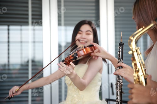 Preview: young woman violinist musician playing workshop classical violin music at home studio
